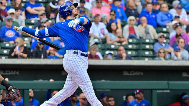 Mar 23, 2023; Mesa, Arizona, USA; Chicago Cubs left fielder Ian Happ (8) flies out in the first inning against the Arizona Diamondbacks during a Spring Training game at Sloan Park. Mandatory Credit: Matt Kartozian-USA TODAY Sports